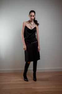 JAGYCH AW 25 ESSENTIALS BRUTAL REFINEMENT STRAP BLOUSE KILT WOOL SKIRT NECKLACE