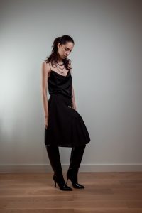 JAGYCH AW 25 ESSENTIALS BRUTAL REFINEMENT STRAP BLOUSE KILT WOOL SKIRT NECKLACE