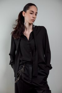 JAGYCH AW 25 ESSENTIALS BRUTAL REFINEMENT BYRON SHIRT IN BLACK CRYSTAL CROSS EARINGS TROUSERS CHAIN