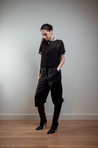 AGYCH AW 25 ESSENTIALS BRUTAL REFINEMENT SEE THROUGH BLOUSE STRAP BLOUSE IN BLACK NECKLACE TROUSERS CHAIN