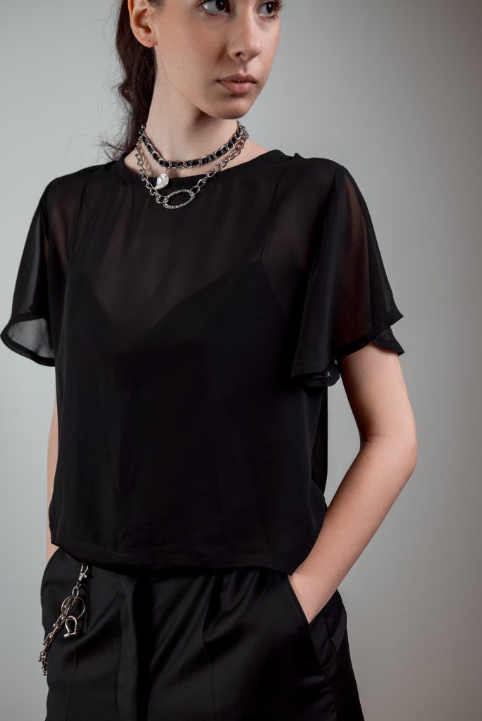 AGYCH AW 25 ESSENTIALS
BRUTAL REFINEMENT

SEE THROUGH BLOUSE
STRAP BLOUSE IN BLACK
NECKLACE
TROUSERS
CHAIN