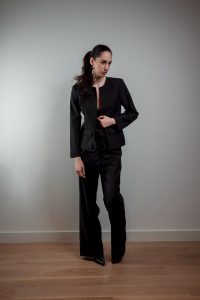 JAGYCH AW 25 ESSENTIALS BRUTAL REFINEMENT OSCAR WOOL JACKET STRAP BLOUSE IN BLACK TROUSERS PENDANT CHAIN