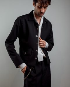 JAGYCH AW 25 ESSENTIALES BRUTAL REFINEMENT METAL HEART WOOL JACKET BYRON SHIRT IN WHITE TROUSERS CHAIN